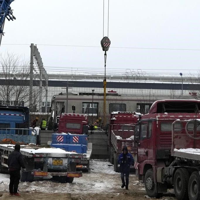 More than 100 injured in a Beijing rail collision as heavy snow hits the Chinese capital